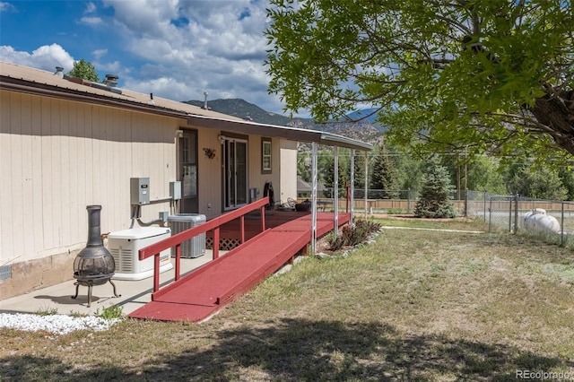 246 Loop Dr, Howard, CO 81233 - back of house with central AC unit, metal roof, and a deck with mountain view