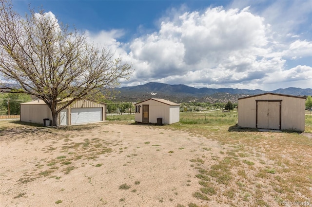 246 Loop Dr, Howard, CO 81233 - view of yard with a garage and a mountain view