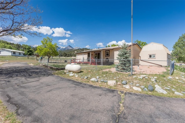 246 Loop Dr, Howard, CO 81233 - view of front of home with a fenced front yard and a mountain view