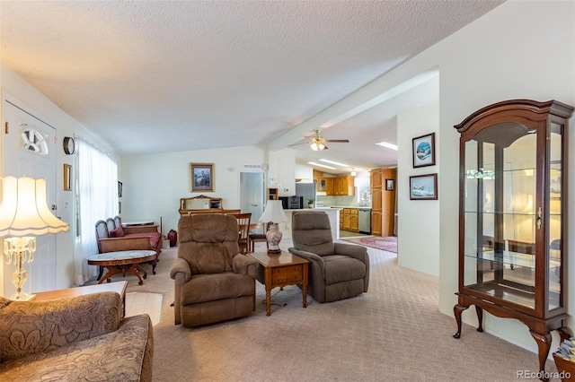 246 Loop Dr, Howard, CO 81233 - living area featuring vaulted ceiling, healthy amount of natural light, light carpet, a ceiling fan, and a textured ceiling