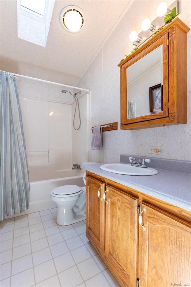 246 Loop Dr, Howard, CO 81233 - full bath with vanity, shower / bath combo with shower curtain, a skylight, tile patterned flooring, and toilet