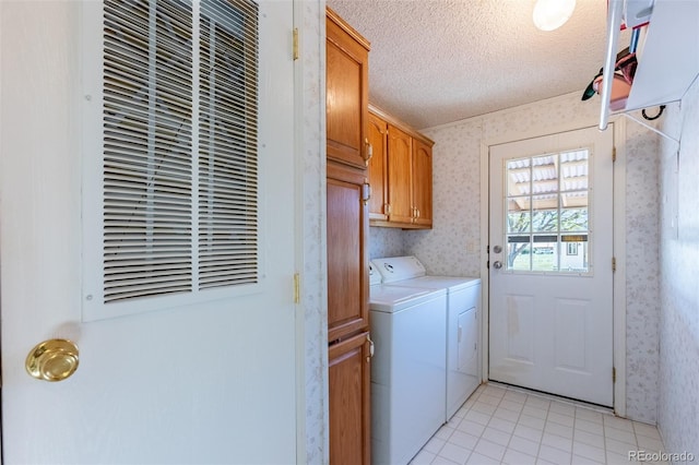 246 Loop Dr, Howard, CO 81233 - laundry room with washing machine and clothes dryer, cabinet space, wallpapered walls, a heating unit, and a textured ceiling