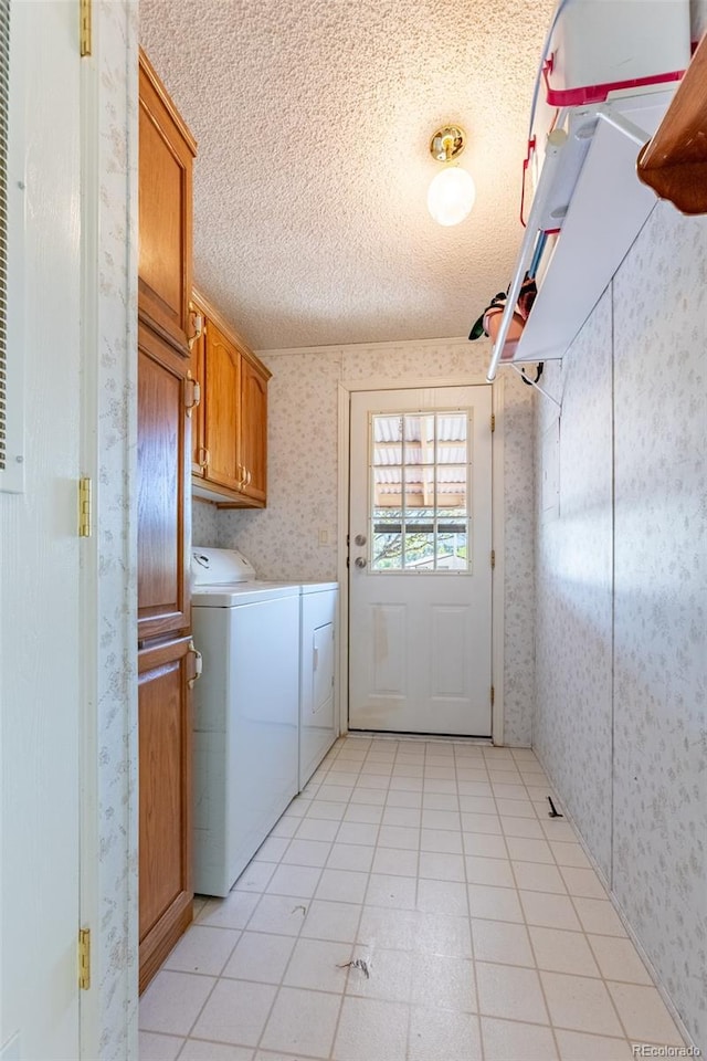 246 Loop Dr, Howard, CO 81233 - laundry room with wallpapered walls, cabinet space, independent washer and dryer, and a textured ceiling
