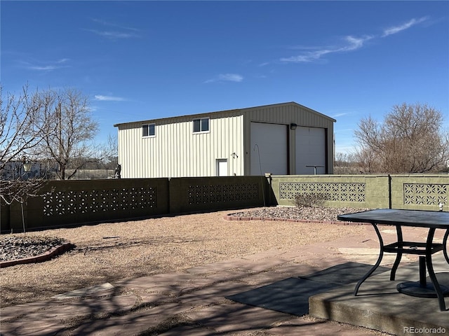 view of outdoor structure with an outdoor structure and fence