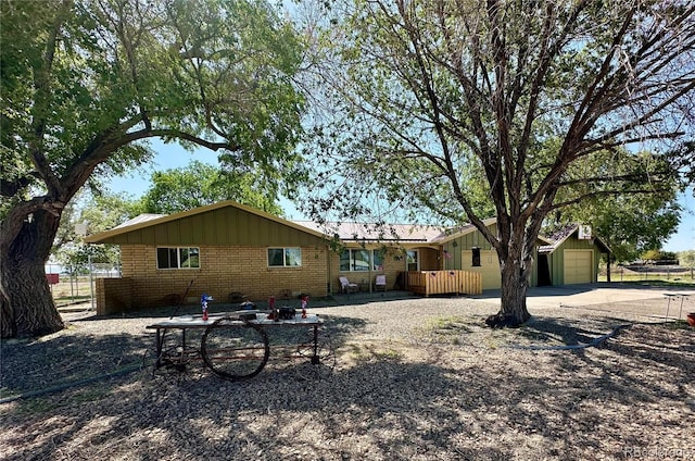5879 Blue Spruce Ave, Alamosa, CO 81101 - rear view of house featuring brick siding and board and batten siding