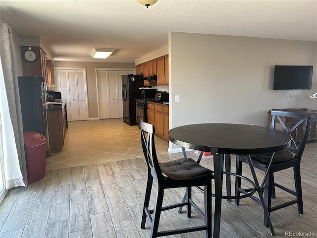 5879 Blue Spruce Ave, Alamosa, CO 81101 - dining room with light wood finished floors