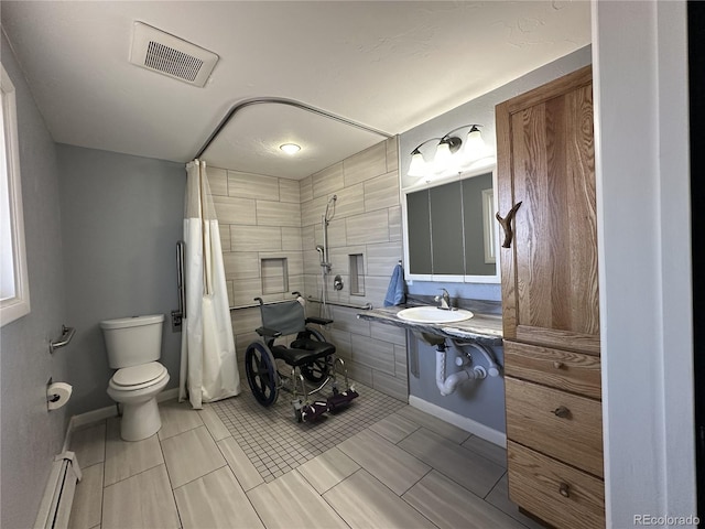5879 Blue Spruce Ave, Alamosa, CO 81101 - full bathroom with a baseboard heating unit and a tile shower