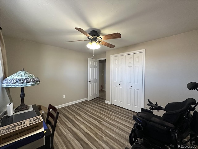 5879 Blue Spruce Ave, Alamosa, CO 81101 - bedroom with wood finished floors, a closet, and a ceiling fan