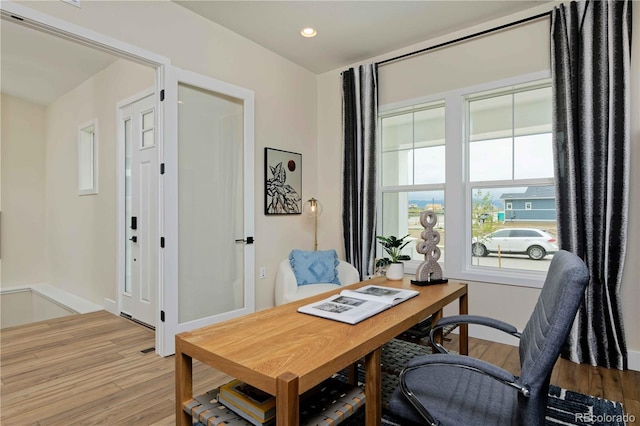 office with light hardwood / wood-style floors