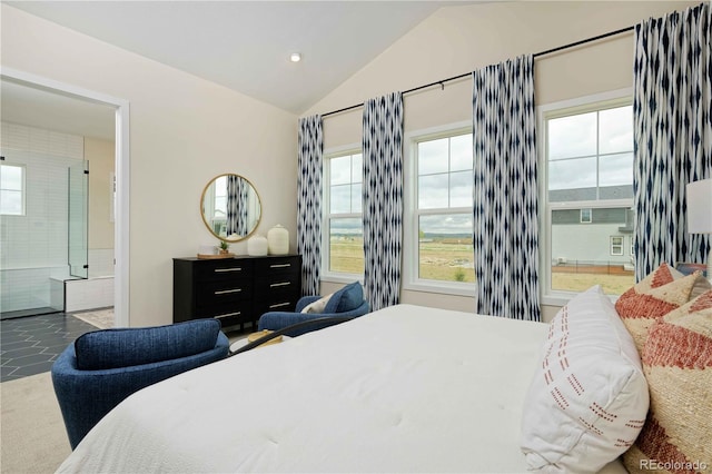 tiled bedroom with lofted ceiling and ensuite bath