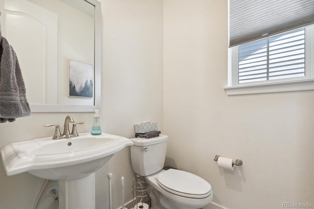 bathroom with toilet and sink