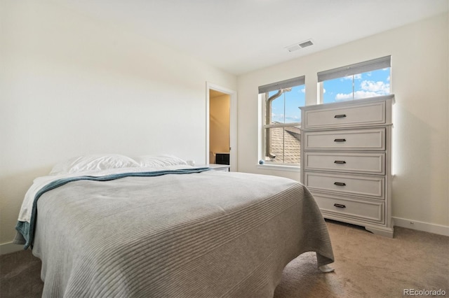 bedroom with light carpet