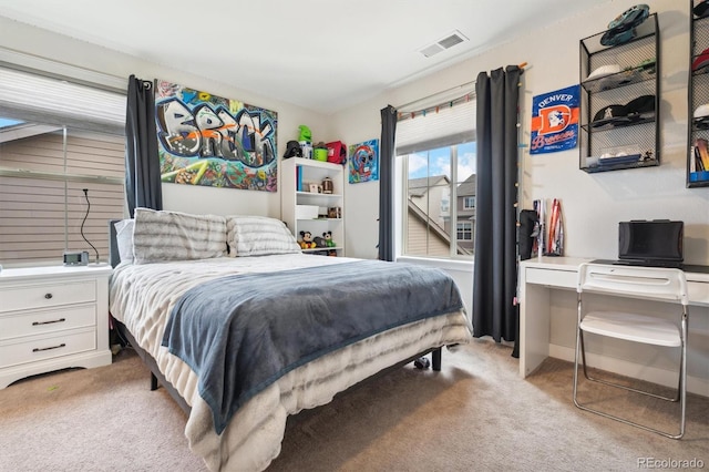 bedroom featuring light colored carpet