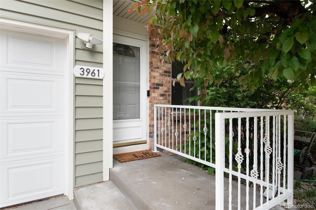 3961 S Uravan St, Aurora, CO 80013 - doorway to property featuring a porch