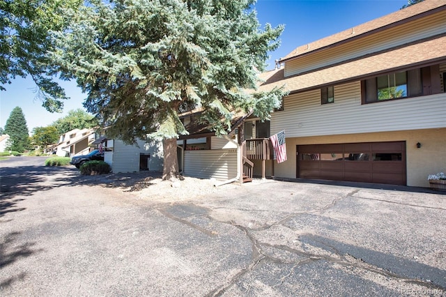 view of property exterior with a garage