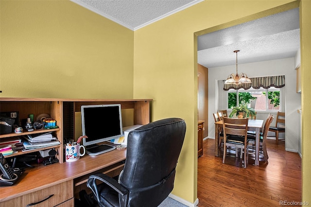 office space featuring a textured ceiling, dark wood-type flooring, and a notable chandelier