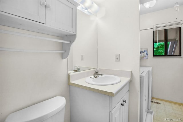 bathroom with vanity and toilet