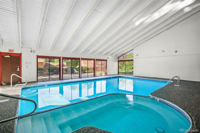 view of swimming pool with a hot tub