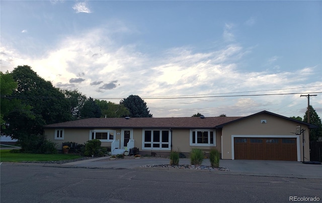 ranch-style house featuring a garage