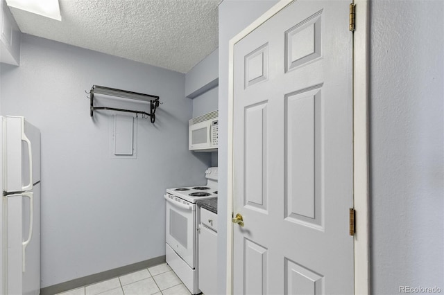 1020 15th St Unit 25D, Denver, CO 80202 - kitchen with white appliances, light tile patterned floors, and a textured ceiling