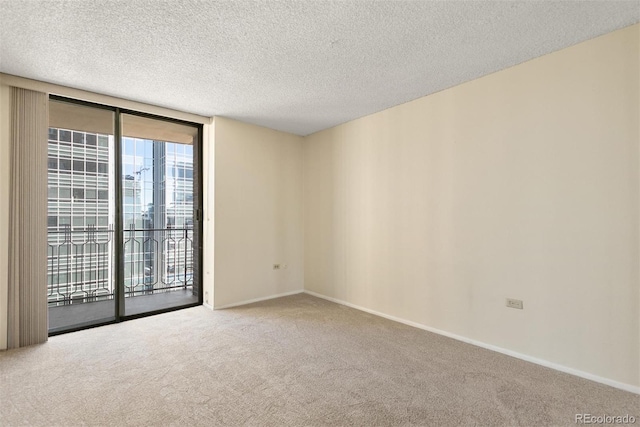 1020 15th St Unit 25D, Denver, CO 80202 - carpeted spare room with baseboards and a textured ceiling