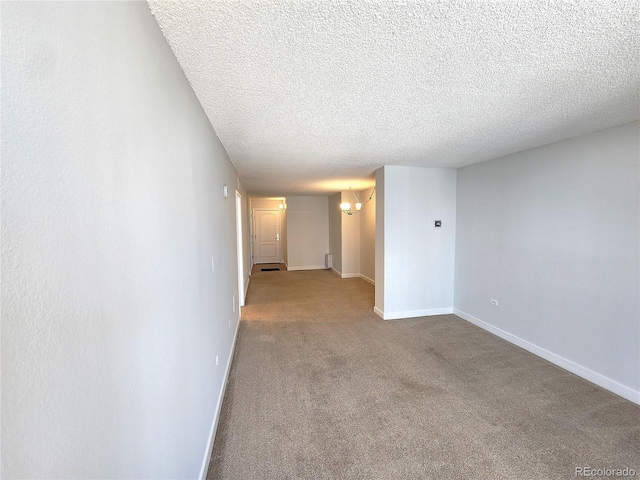 1020 15th St Unit 25D, Denver, CO 80202 - carpeted spare room with baseboards, a textured ceiling, and a chandelier