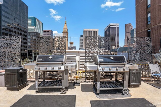 1020 15th St Unit 25D, Denver, CO 80202 - view of patio with a skyline view and a grill