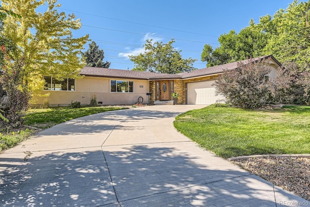 view of front of house featuring a front yard and a garage