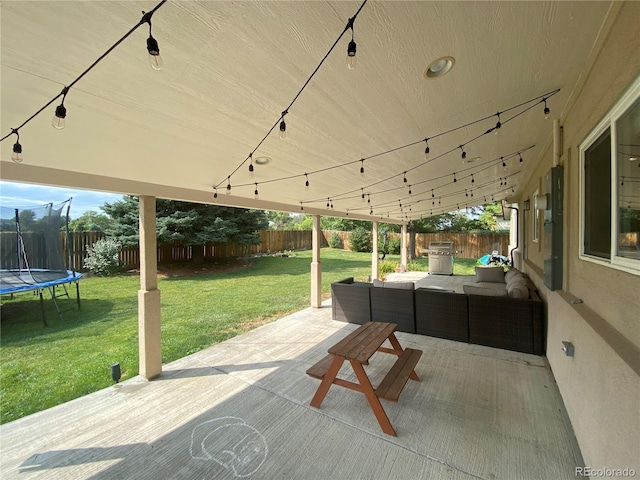 view of patio featuring grilling area, a trampoline, and outdoor lounge area