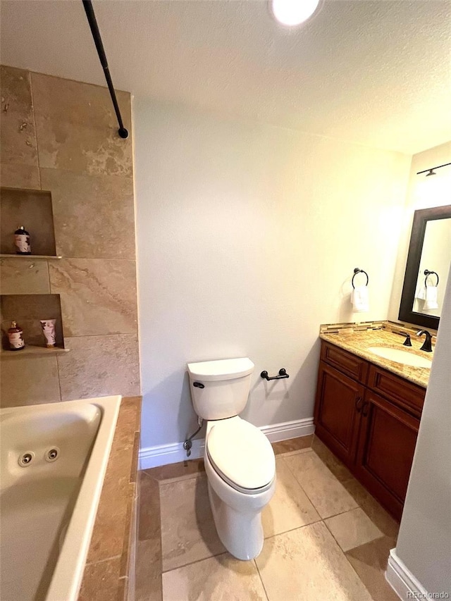 bathroom featuring toilet, a washtub, a textured ceiling, tile patterned floors, and vanity