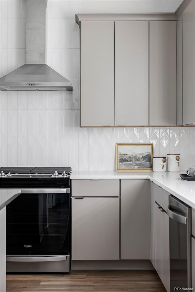 15006 Cast Pebble Cir, Parker, CO 80134 - kitchen with appliances with stainless steel finishes, wall chimney range hood, gray cabinetry, modern cabinets, and tasteful backsplash
