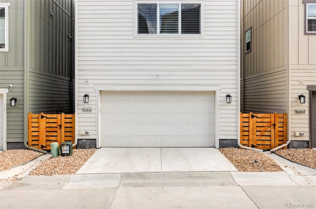 15006 Cast Pebble Cir, Parker, CO 80134 - view of exterior entry with an attached garage and concrete driveway