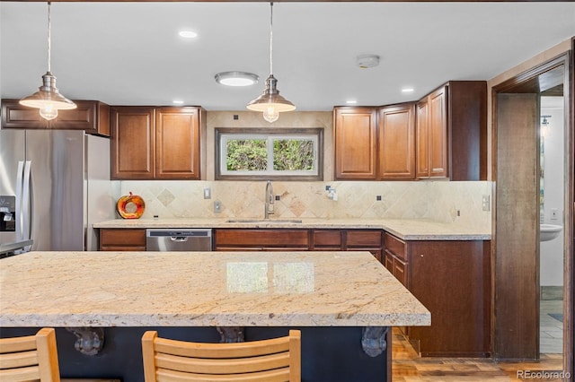 55 Two Moon Rd, Idaho Springs, CO 80452 - kitchen featuring stainless steel appliances, backsplash, light wood finished floors, decorative light fixtures, and recessed lighting