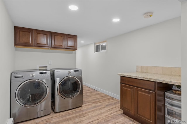 55 Two Moon Rd, Idaho Springs, CO 80452 - laundry room with separate washer and dryer, light wood-style flooring, cabinet space, and recessed lighting