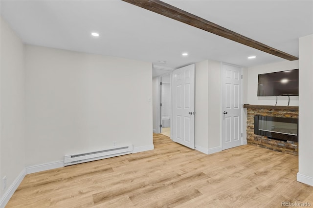 55 Two Moon Rd, Idaho Springs, CO 80452 - unfurnished living room featuring a baseboard radiator, wood finished floors, recessed lighting, a fireplace, and beamed ceiling