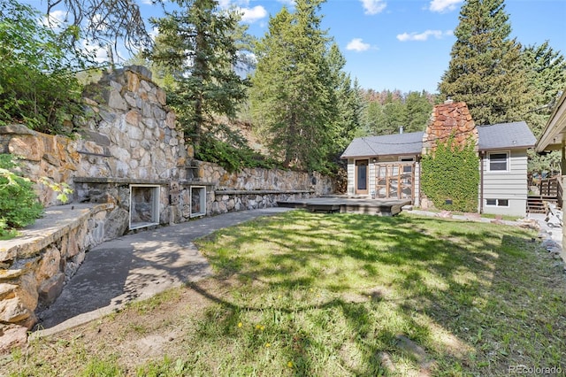 55 Two Moon Rd, Idaho Springs, CO 80452 - view of green lawn featuring a wooden deck