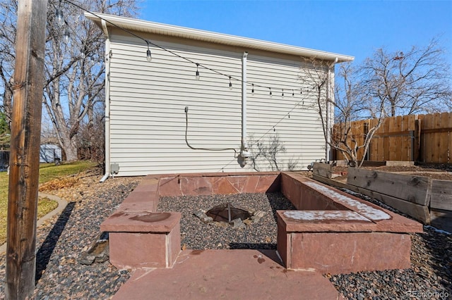 view of side of home with fence