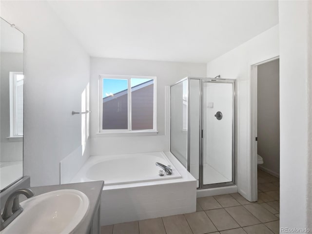 full bathroom with independent shower and bath, vanity, tile patterned floors, and toilet