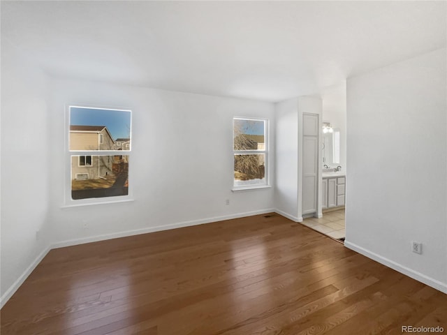 empty room with light hardwood / wood-style floors