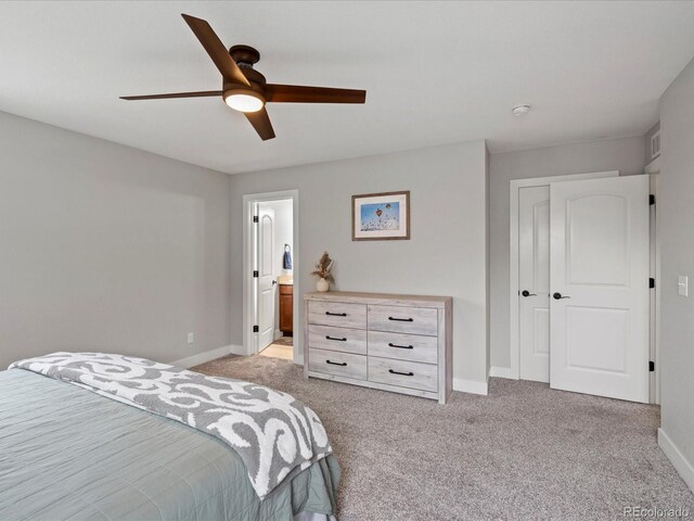 14823 W 70th Dr Unit A, Arvada, CO 80007 - bedroom with light colored carpet, baseboards, a closet, and ceiling fan