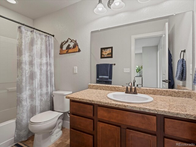 14823 W 70th Dr Unit A, Arvada, CO 80007 - bathroom with vanity, toilet, shower / bath combo, and tile patterned floors
