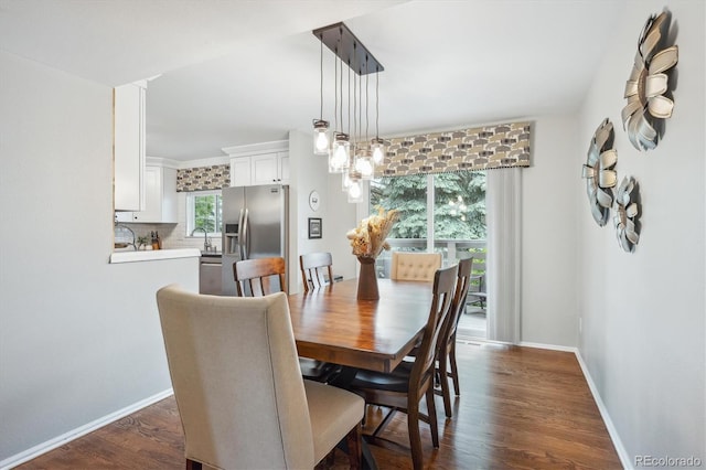 6880 E Appleton Cir, Centennial, CO 80112 - dining area with dark wood-style floors and baseboards