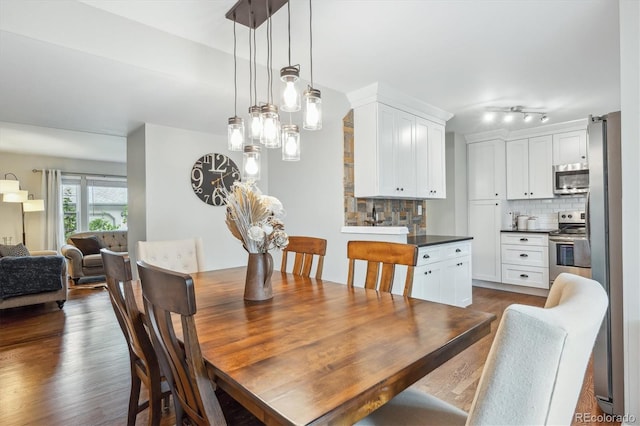 6880 E Appleton Cir, Centennial, CO 80112 - dining space featuring dark wood-type flooring