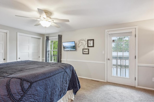 6880 E Appleton Cir, Centennial, CO 80112 - bedroom with access to exterior, carpet floors, baseboards, a ceiling fan, and two closets