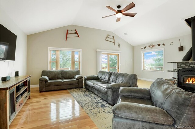 41504 Vista Rdg, Parker, CO 80138 - living room featuring light wood-type flooring, ceiling fan, lofted ceiling, and baseboards
