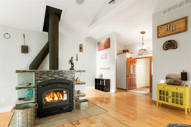 41504 Vista Rdg, Parker, CO 80138 - living area featuring vaulted ceiling, wood finished floors, and baseboards
