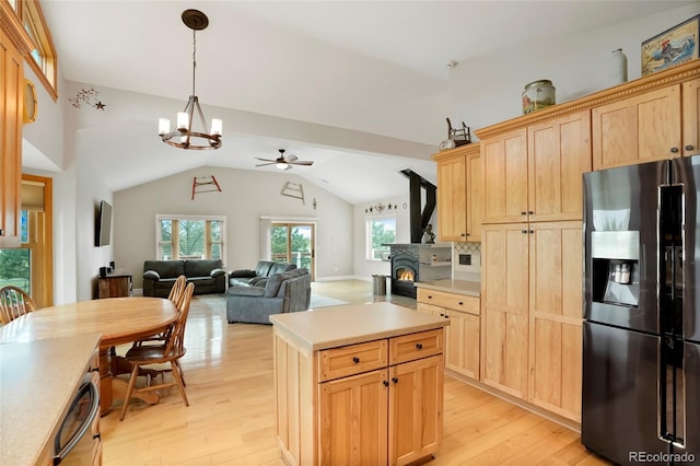41504 Vista Rdg, Parker, CO 80138 - kitchen with black fridge with ice dispenser, a ceiling fan, light wood-style floors, light brown cabinetry, and lofted ceiling