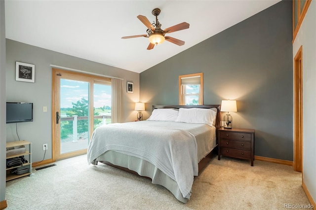 41504 Vista Rdg, Parker, CO 80138 - bedroom featuring access to exterior, lofted ceiling, light colored carpet, baseboards, and multiple windows
