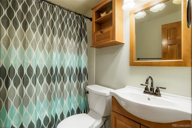 41504 Vista Rdg, Parker, CO 80138 - bathroom with toilet, vanity, and a shower with curtain