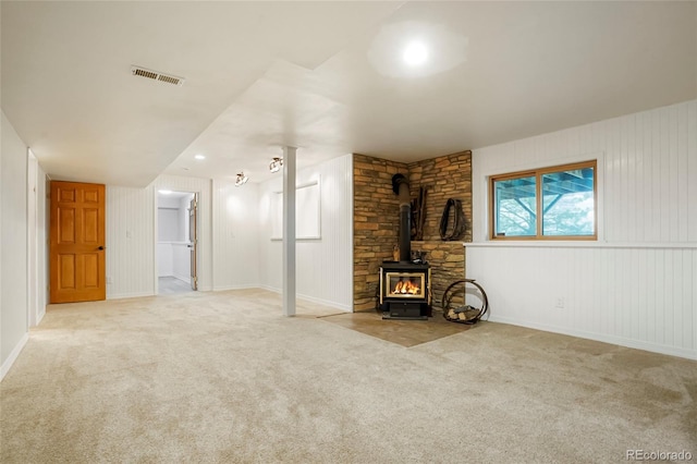 41504 Vista Rdg, Parker, CO 80138 - unfurnished living room with carpet flooring, a wood stove, and baseboards
